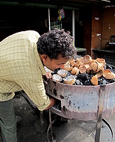 Coconut shells fuel a Dhaba stove / oven for Tamil Parotta and Dosa flat breads